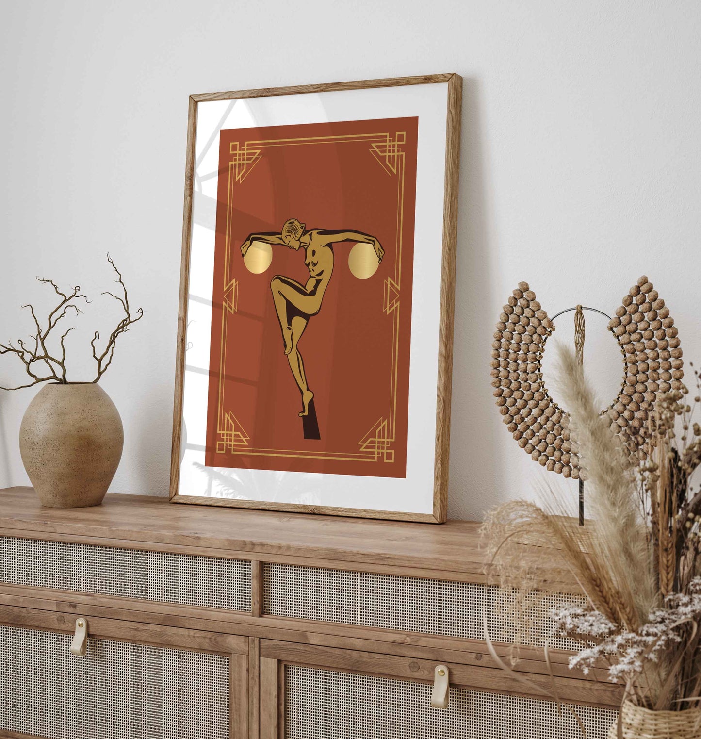 Art deco wall art print with a statue type woman holding two golden globes in orange and gold